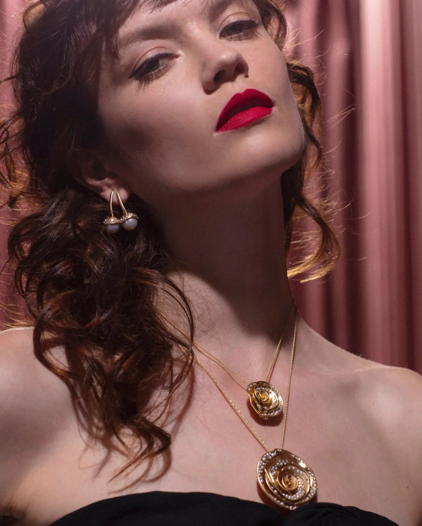 Close-up of a model's face and neck wearing Nada Ghazal jewelry